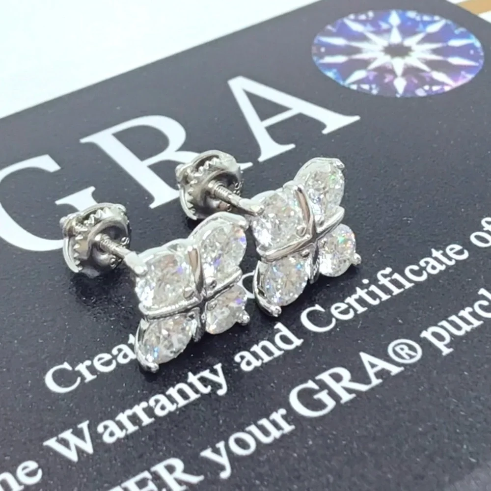 1.6ct Moissanite Cross Over Stud Earrings . Platinum plated .